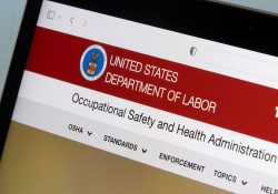 Website homepage of the Occupational Safety and Health Administration (OSHA), a regulatory agency of the United States Department of Labor, is seen on a computer.